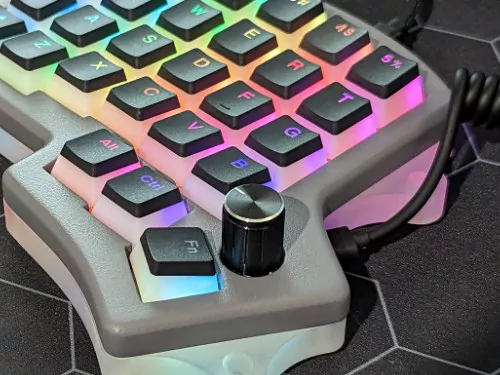 A custom split mechanical keyboard on a desk